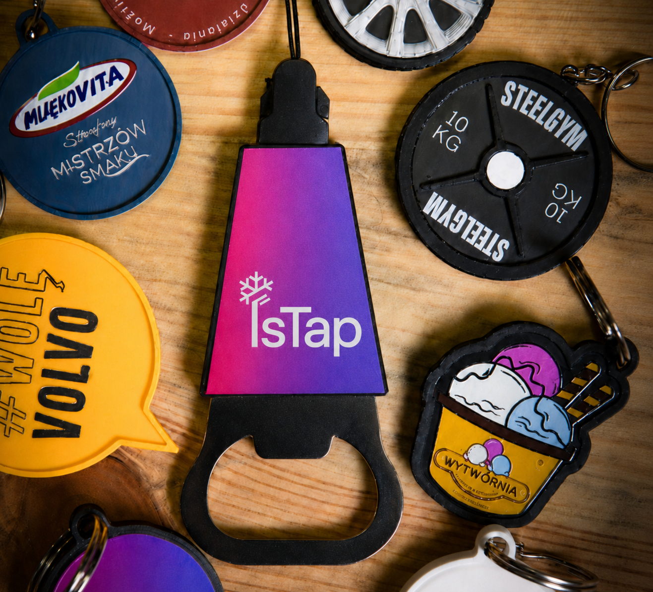 Two white IsTap NFC key tags with QR code and custom logo